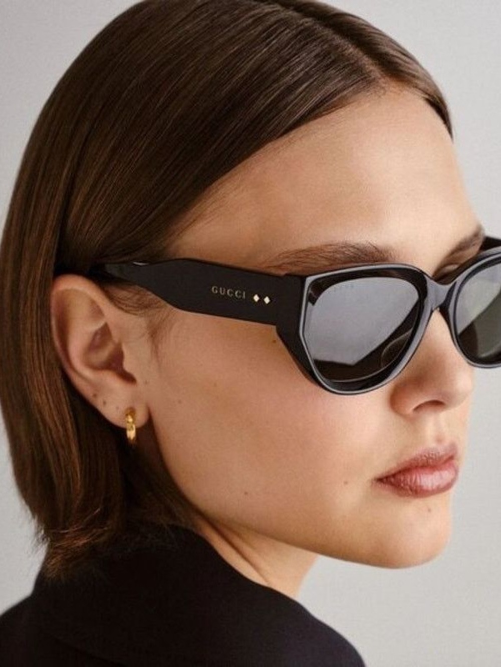 Authentic Gucci Glossy Black Cat-Eye Sunglasses with Gold Accents
